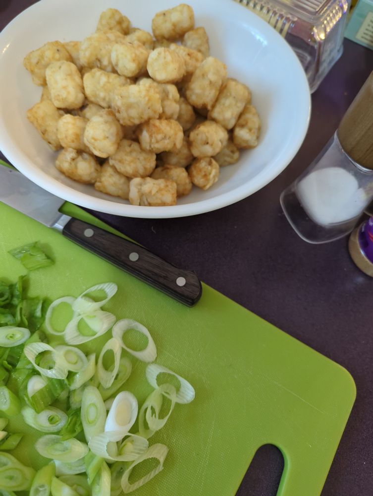 Picture of tater tots, green onions, and seasoning for fried tater tot waffles.