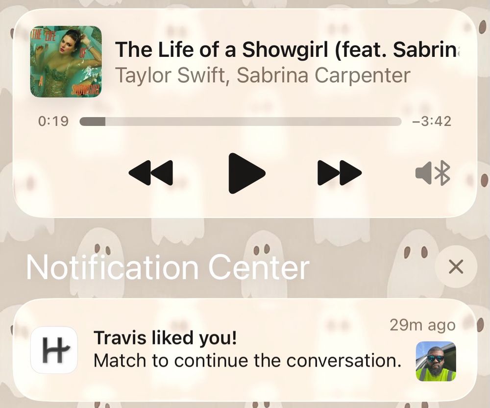 A screenshot of my home screen showing me listening to TLOAS and getting a hinge notification that a man named Travis liked me