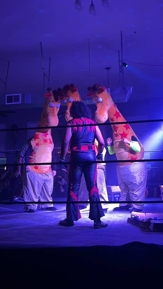 wrestler J George stares down 3 geofries