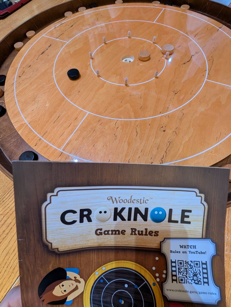 a shiny new Crokinole board and instruction manual