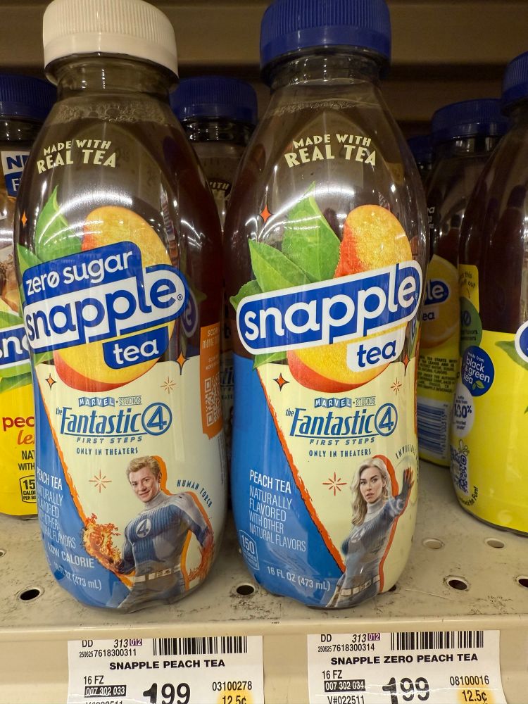 Two bottles of Snapple peach tea sitting on a shelf. The left bottle is zero sugar and has a photo of Johnny Storm. The right bottle has a photo of Sue Storm, bucking the historical trend of the diet foods being associated with women.
