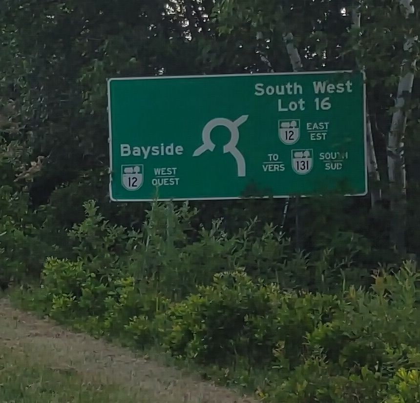 A sign for a roundabout with exits marked as described