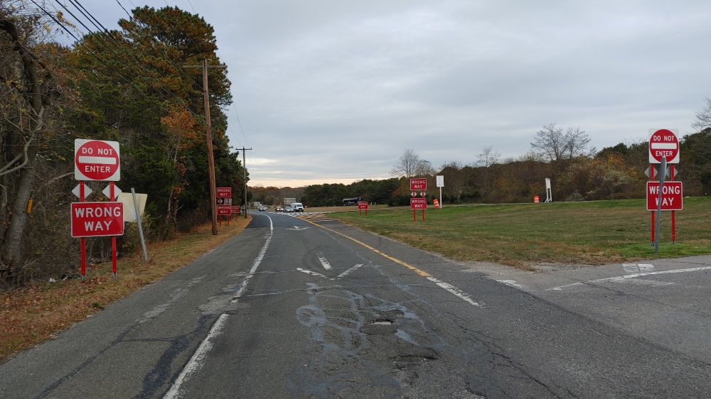 Eight "Wrong way" signs coming off highway ramp