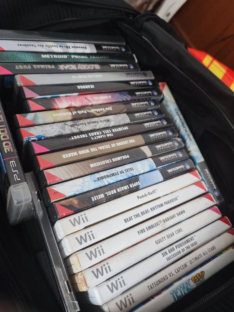 Mon sac avec une selection de jeux GameCube Wii et un jeu de PS3.