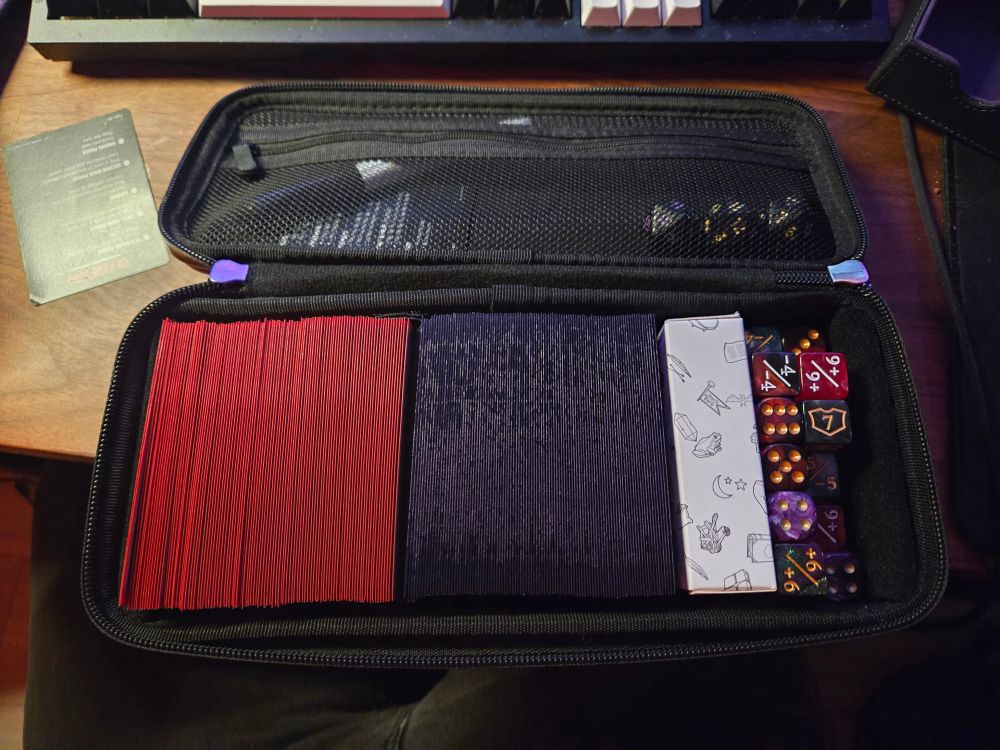 quiver time deck box opened with two decks, tokens, dice, dry erase markers, and a phase order card >:3