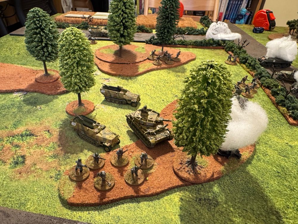 15mm models representing Panzer Lego advancing through a small copse. 