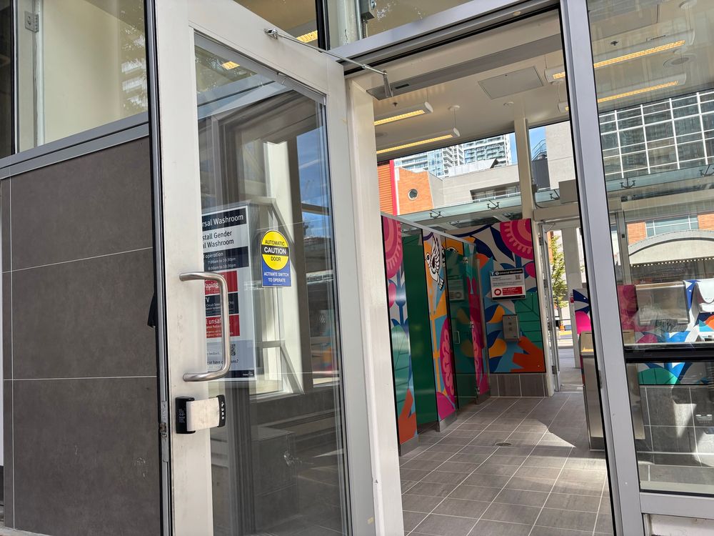 Accessible entrance to washroom with automatic door. 