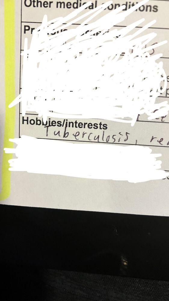 A form with most of it whited out electronically except for the hobbies/interests box with Tuberculosis written in