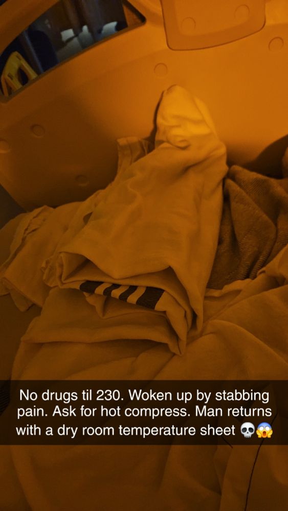 Folded up sheet on a hospital bed.
