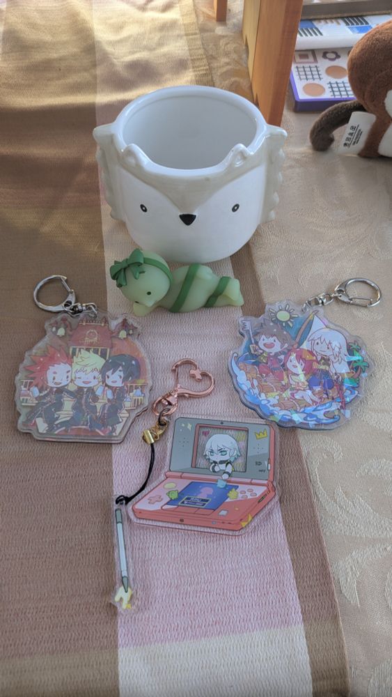 Hedgehog planter, Kingdom Hearts keychains, and a Smiski Bday Blindbox Smiski given to me by my friend for a late bday present