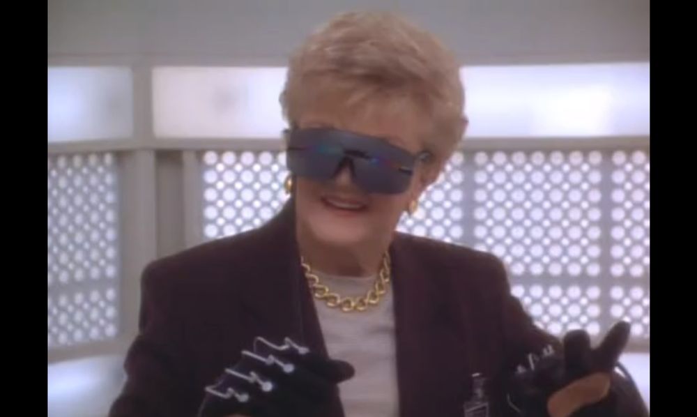 Angela Lansbury as Jessica fletcher wearing smart gloves and a virtual reality headset in Murder She Wrote 