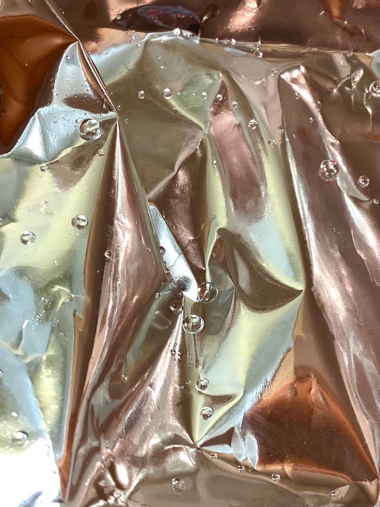 iPad photo of light reflected in foil. Water droplets on folds of copper, bronze, and muted yellows and teal.

The poem's "dominant, unifying figure is drawn from the science of optics, an important source of study and experiment for Coleridge, who once conducted a series of experiments intended to re-create Isaac Newton’s Opticks."  (Guardian, Carol Rumen's Poem of the Week.)