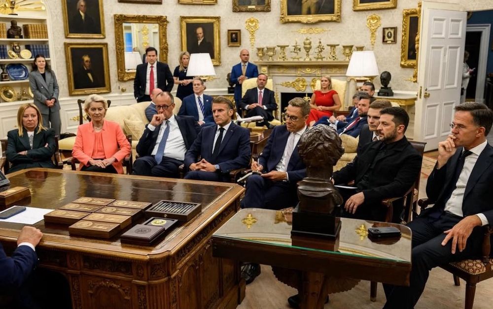 Photo from Trump’s POV behind his desk in the Oval Office of the European leaders and Zelensky all seated before him 