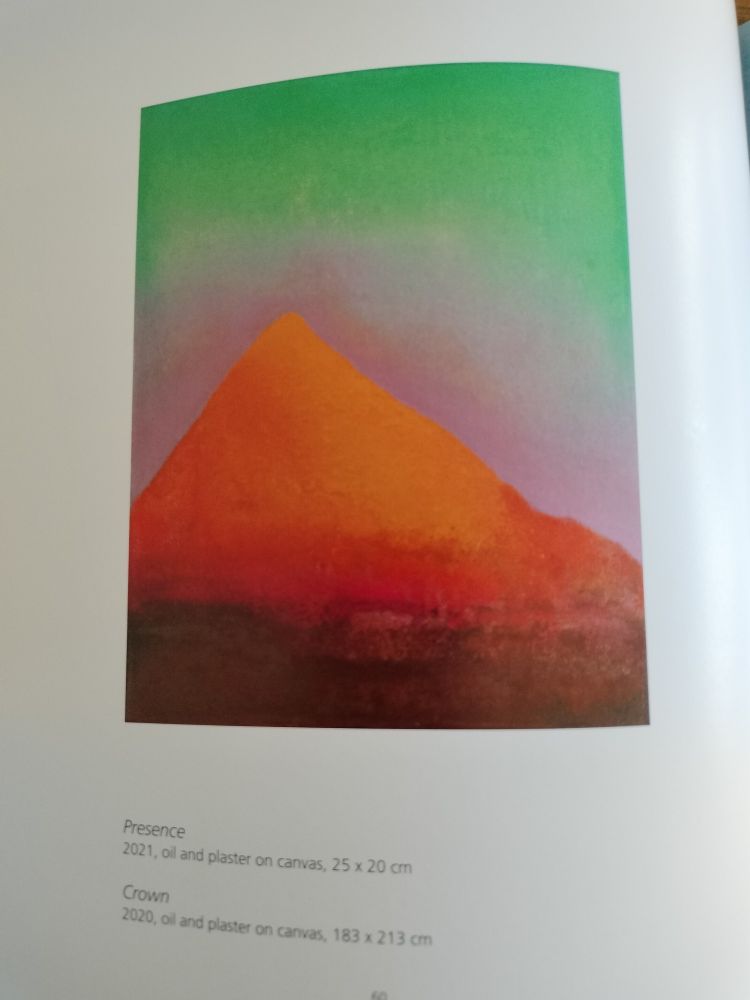 Painting of glowing orange mountain on green background, used for the cover of Ghost Mountain 