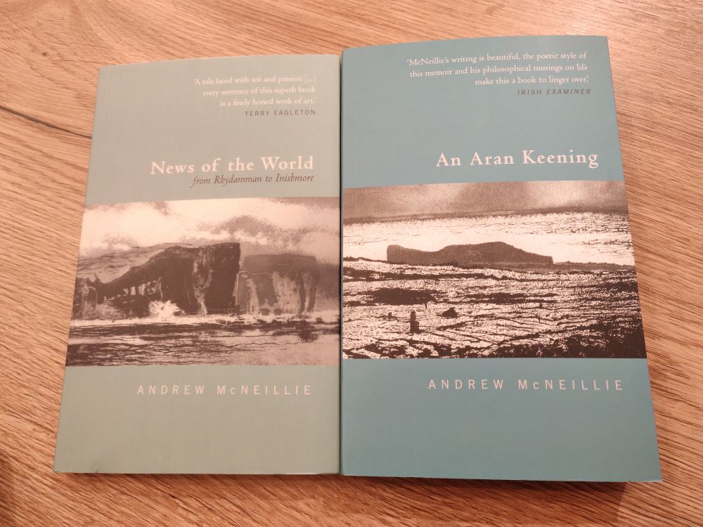 Two book covers. Turquoise colour with black and white etchings of islands by Norman Ackroyd.