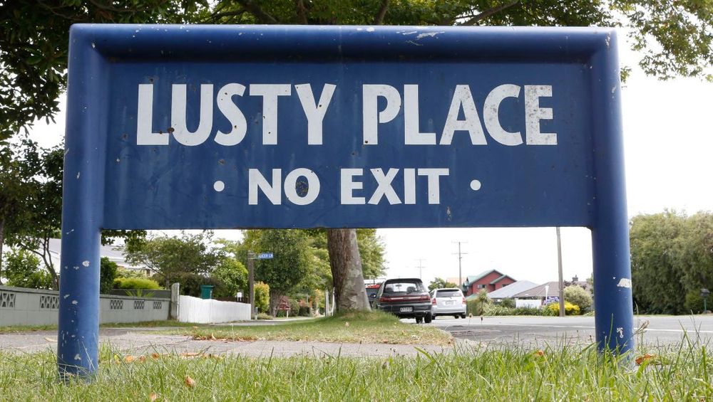 A photograph of a street name sign. It reads Lusty Place No Exit. From Stoke, Te Tau Ihu.