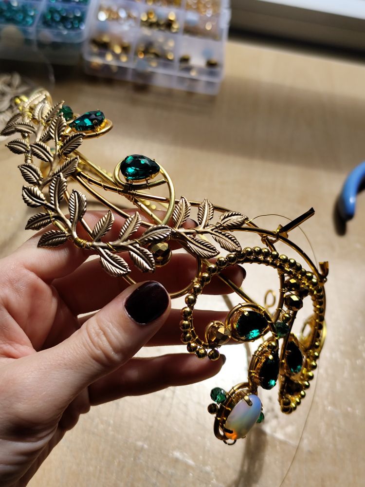 One of my current WIPs: a custom Olasse circlet in gold with emerald green crystals and opalites. Almost there! 
