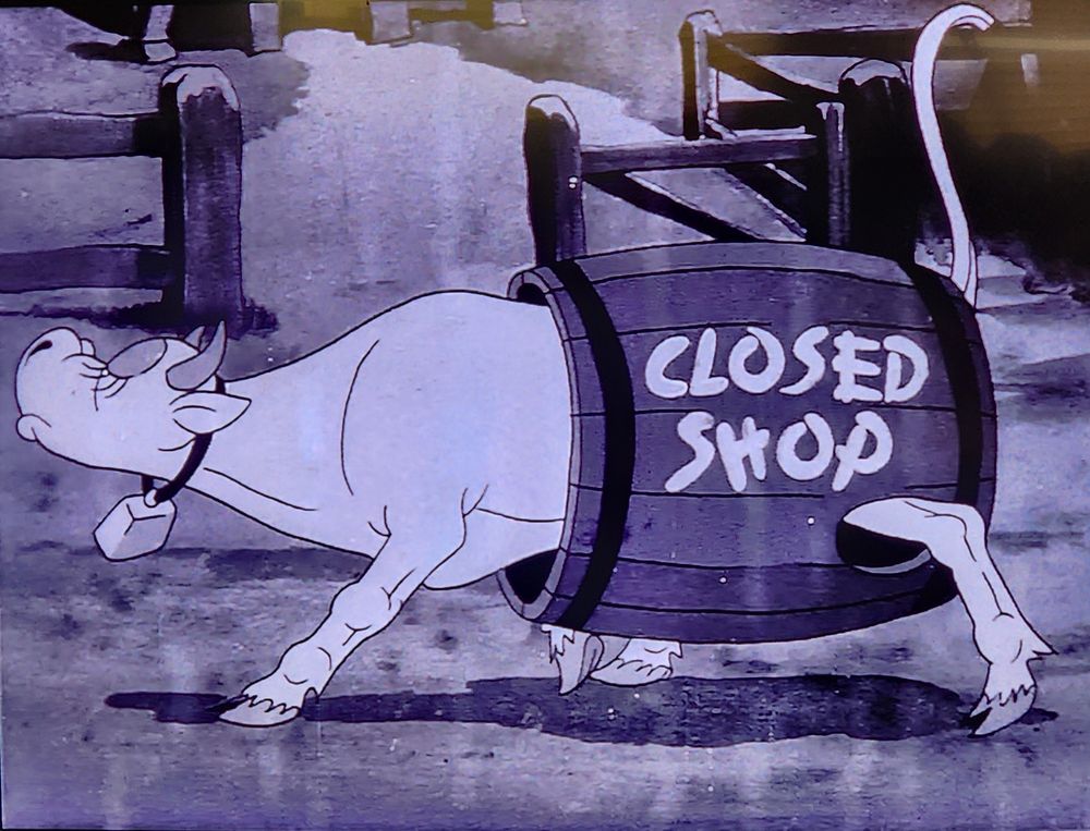 a cow in a porky cartoon wearing a barrel over her udders that says closed shop,