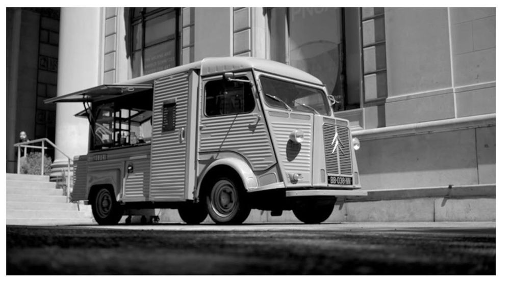 B&W photo of Yoburi Coffee’s truck, a late-60s/1970s-era commercial van made by Citroën. It is angular and brutalist and I love it. 
