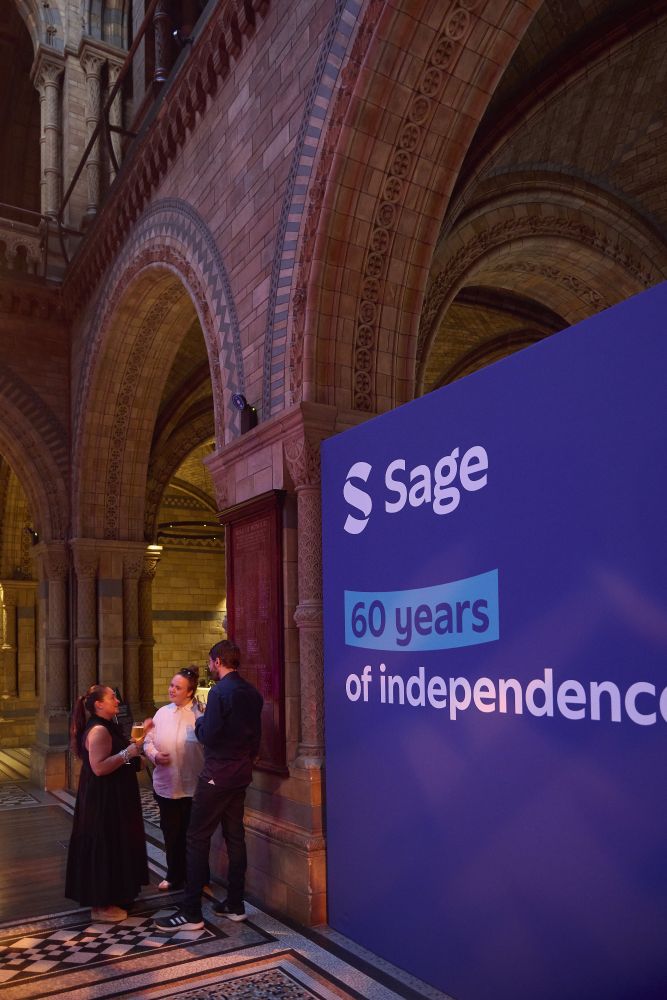 A banner at the Sage Summer Party that says "Sage - 60 years of independence"