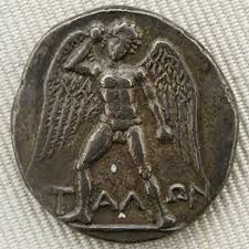 A bronze medal with the legend ταλων naming the winged humanoid which towers over the hills formed by the alpha & lambda