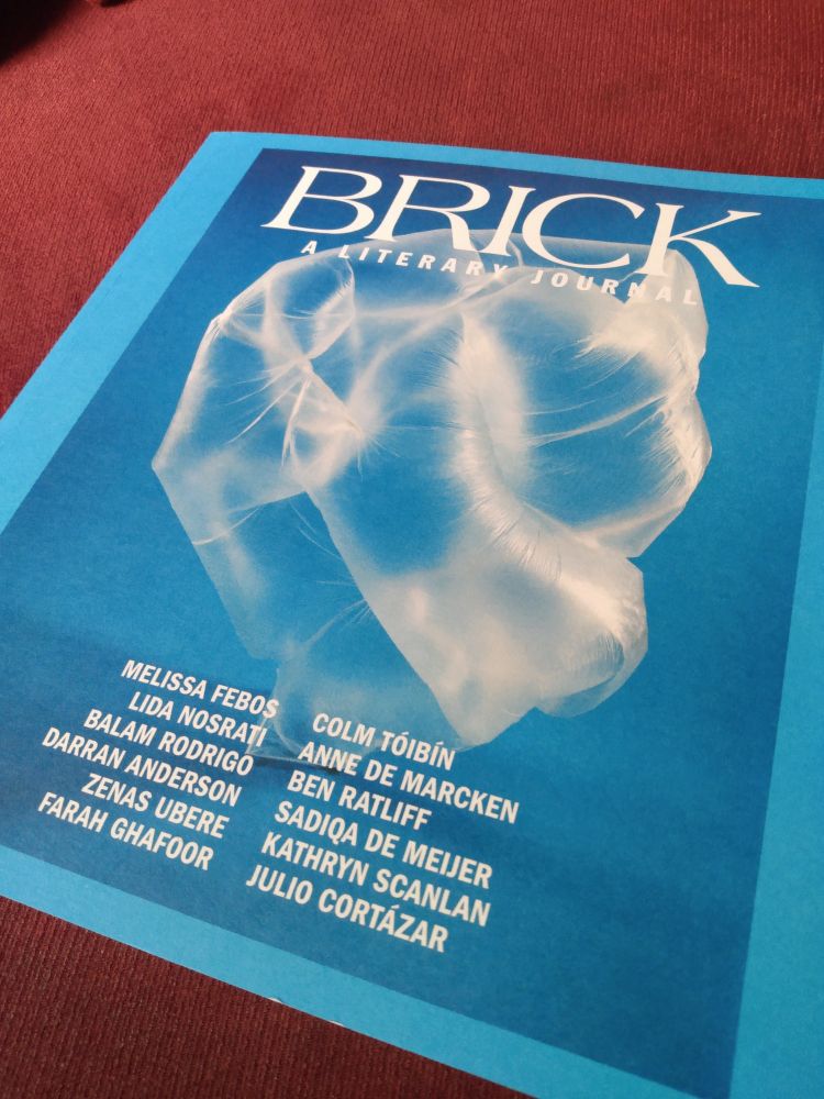 Cover of Brick literary journal, azure blue with a photograph of a clear inflated plastic bag & the author's names.