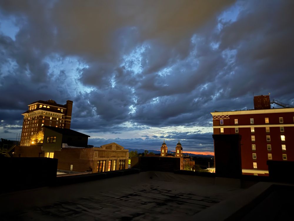 Clouds and skyline in darker blues 