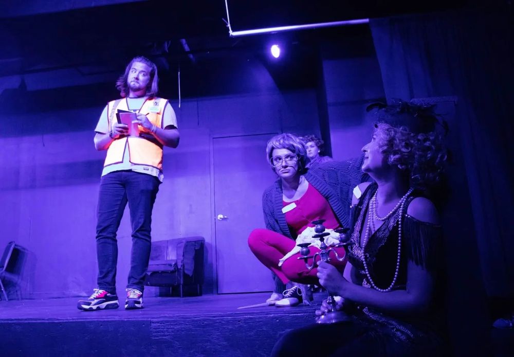 Me performing as The Costco Detective in the opening night of Improvised Clue @ Village Theatre in 2022