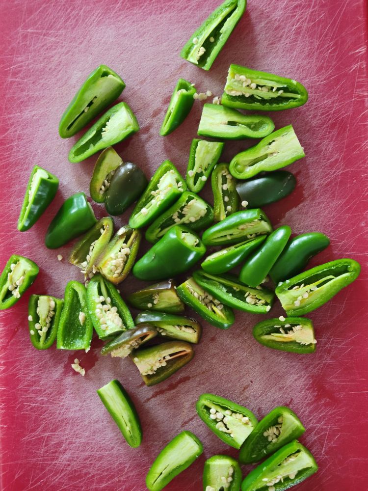 Jalapeños cut in two.