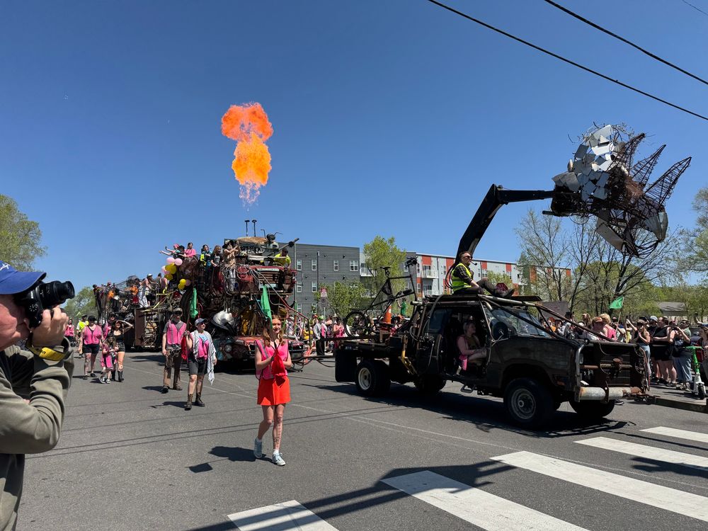 Closer picture of the triceratops truck and flames shooting out of the top of the next float.