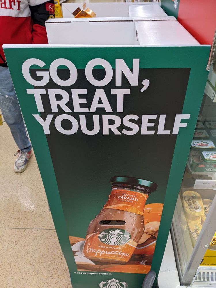 Starbucks ad that reads "GO ON, TREAT YOURSELF" but they have left too little space between the first two words imo
