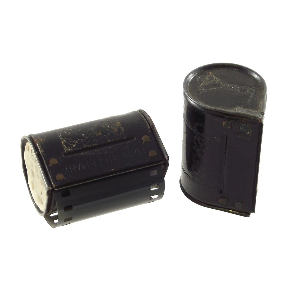 Two Agfa Gevaert Karat film cartridges, one with 35 mm film showing