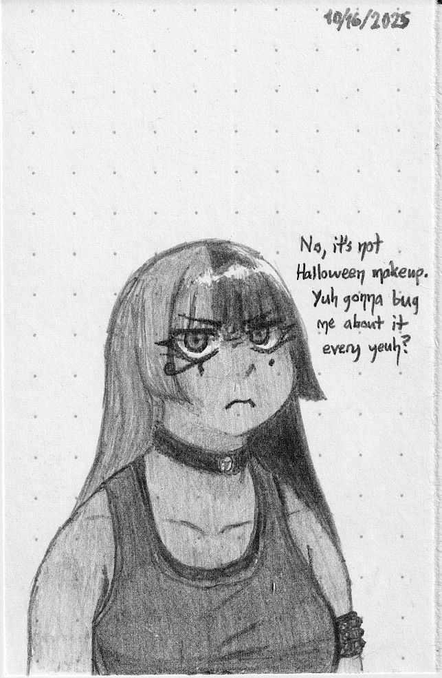 Dya is glaring at the viewer, who has questioned whether she's wearing makeup for Halloween (it's just how she always looks)