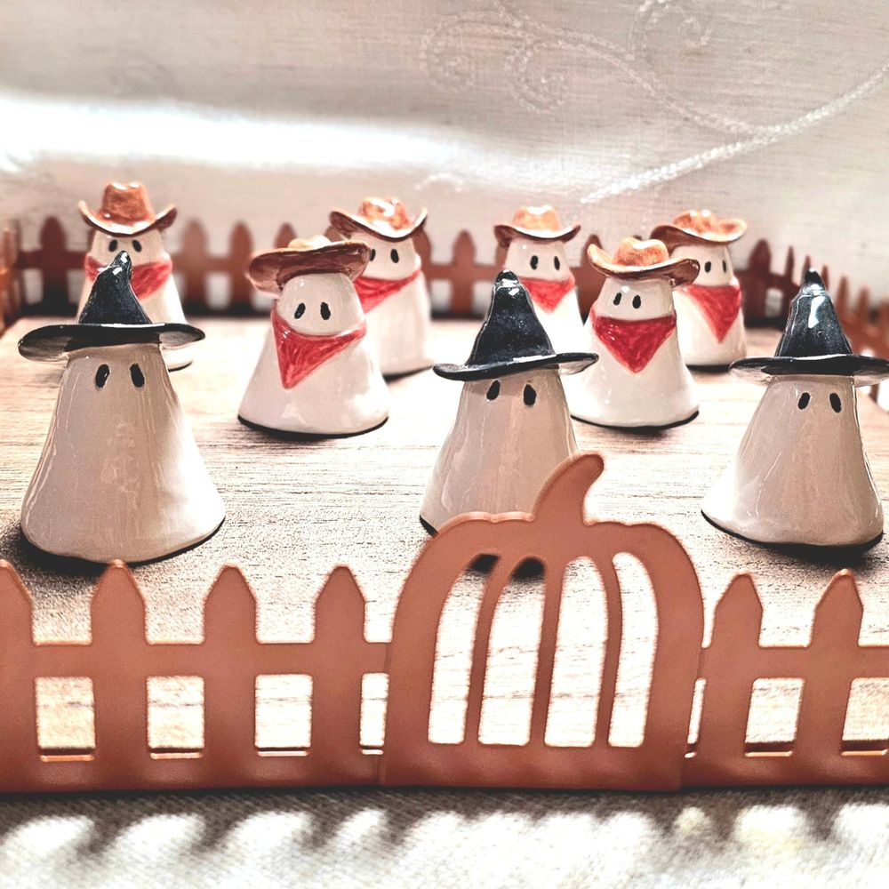 Ceramic ghosties dressed up as Witches and Cowboys
