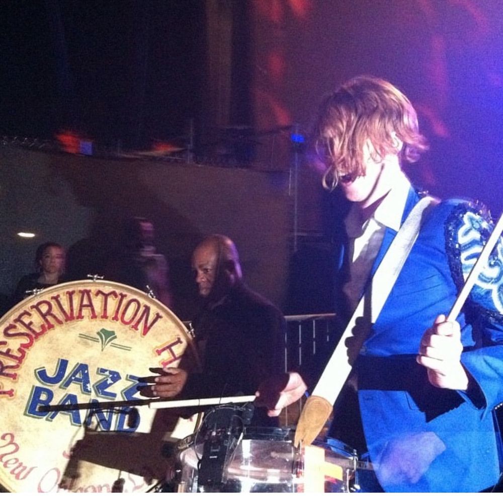 Preservation Hall Jazz Band and Arcade Fire play drums in the crowd at Coachella. 