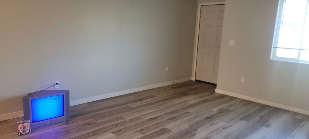 the new townhome with a crt and a copy of guilty gear xrd sign 
