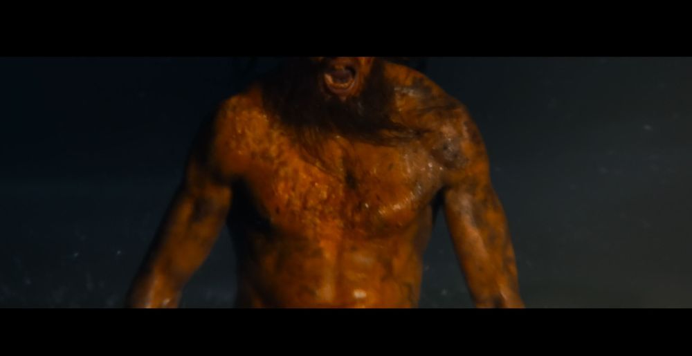 a screenshot from Danny Boyle's 28 Years Later. the alpha running towards the camera