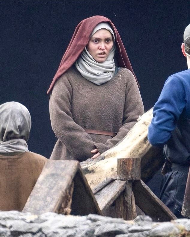 Lily-Rose Depp in medieval costume with a cleft lip