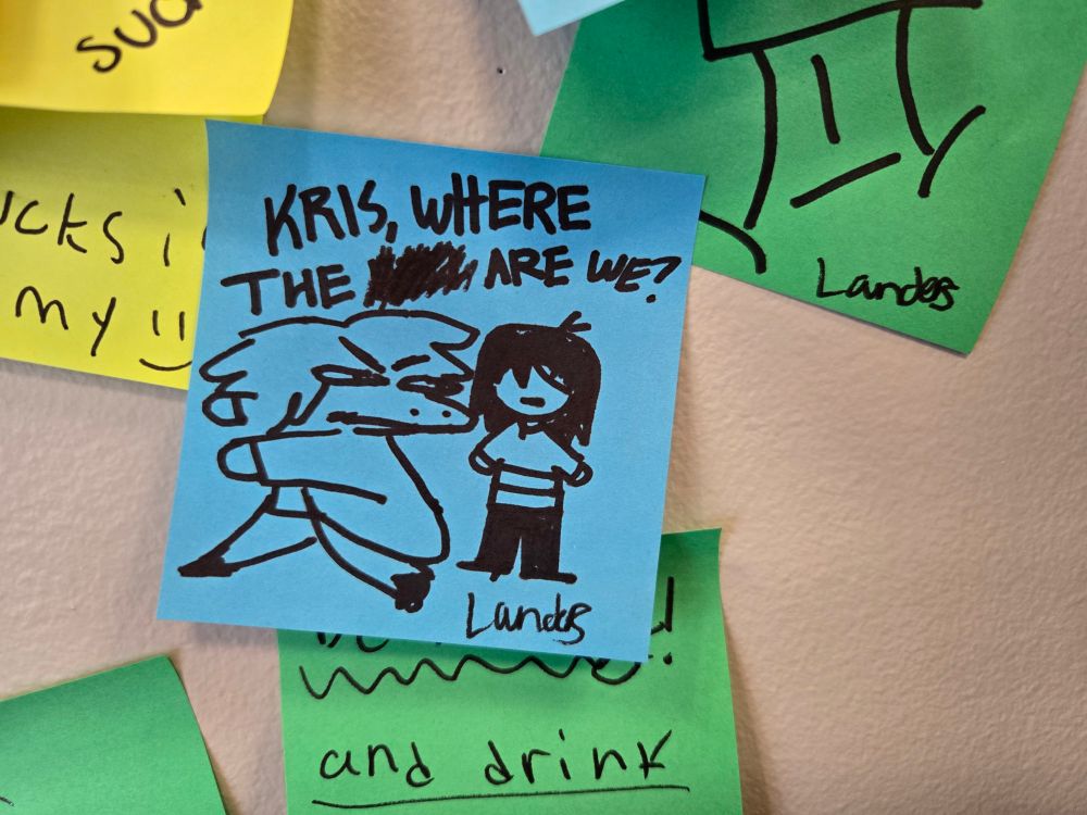 Drawing of Suzy and Kris from Deltarune. Written in sharpie at the top is "KRIS WHERE THE #### ARE WE?" and signed by artist (landos?)