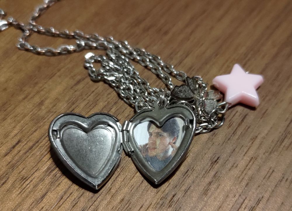 A heart shaped locket containing a loving picture of Jeremy Elbertson 985.