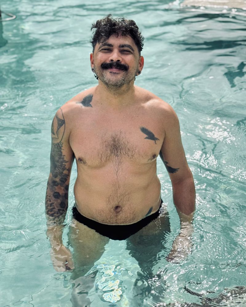 Nivas looking sexy in black swimwear in a thermal bath. 