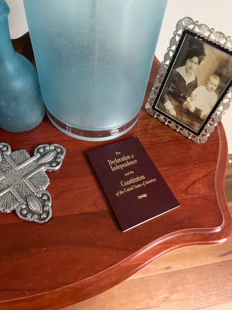 Photo of table with a copy of the USA constitution 