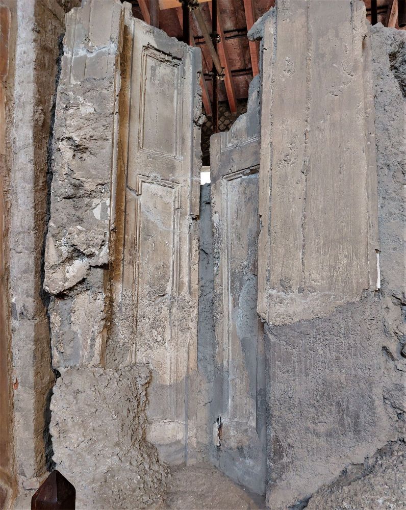 In situ and partly opened, imprints of two tall panelled doors provide details of original opening to portico where view to sea could be seen in a luxurious villa nr Pompeii. The Villa, in the process of renovations at the time, was damaged and buried in Vesuvian eruption, and preserved in excavation.