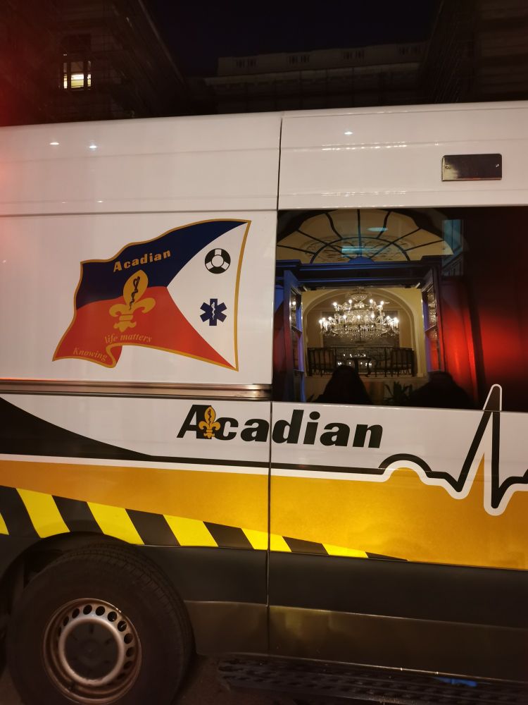 Ambulance with stylized Acadiana flag and the word "Acadian" written on it.