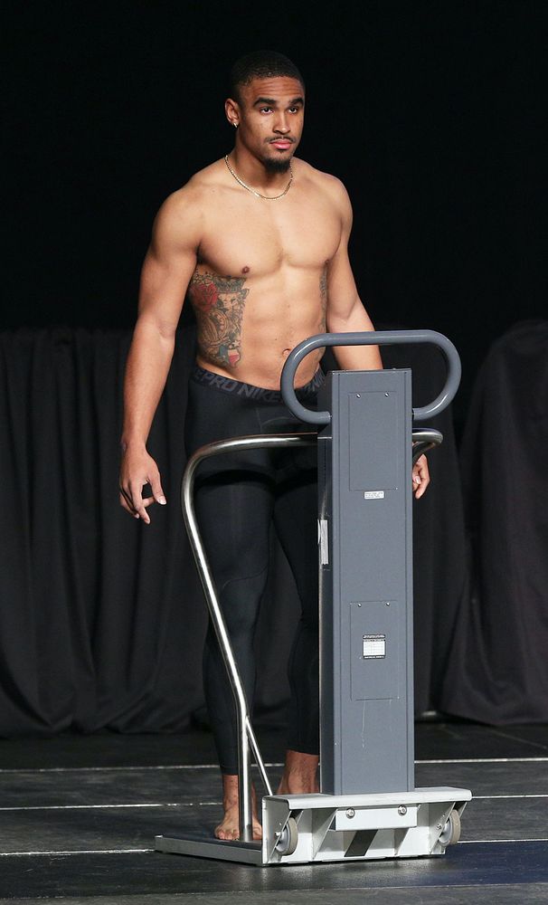 jalen hurts wearing only nike pro tights while shirtless, showing his feet, chest, muscles, abs, muscles, and bulge