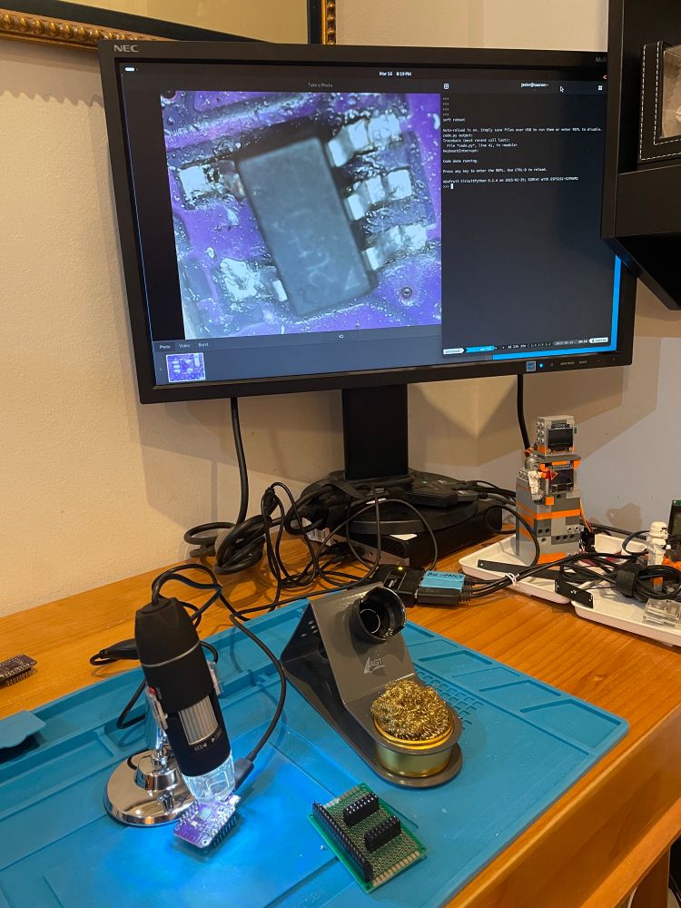 An esp32 s2 mini board with its voltage regulator replaced and a terminal shown that is running circuitpython
