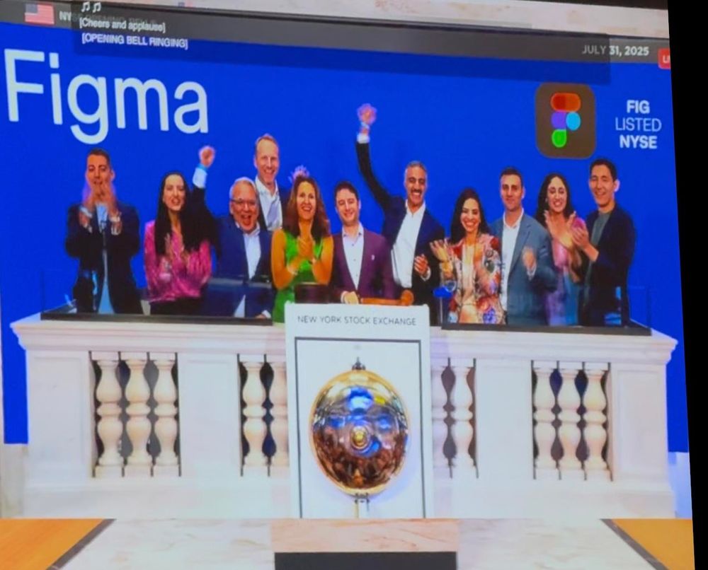 Figma CEO surrounded by cheering executives as he rings the bell at the New York Stock Exchange for Figma’s IPO