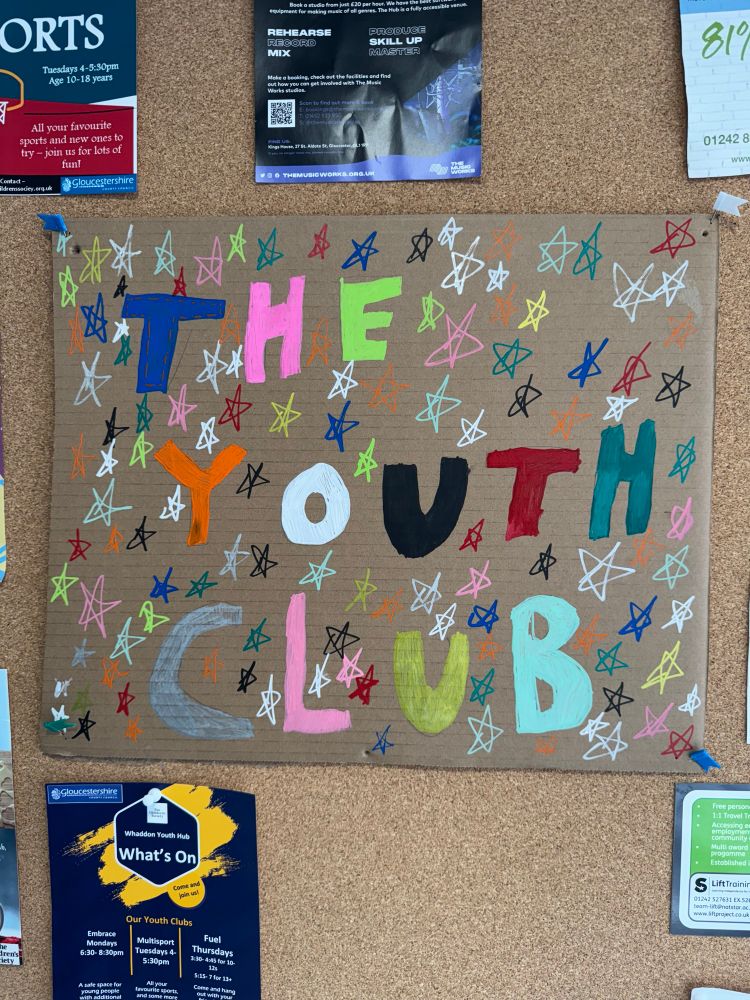 A sign saying “The Youth Club” on a wall