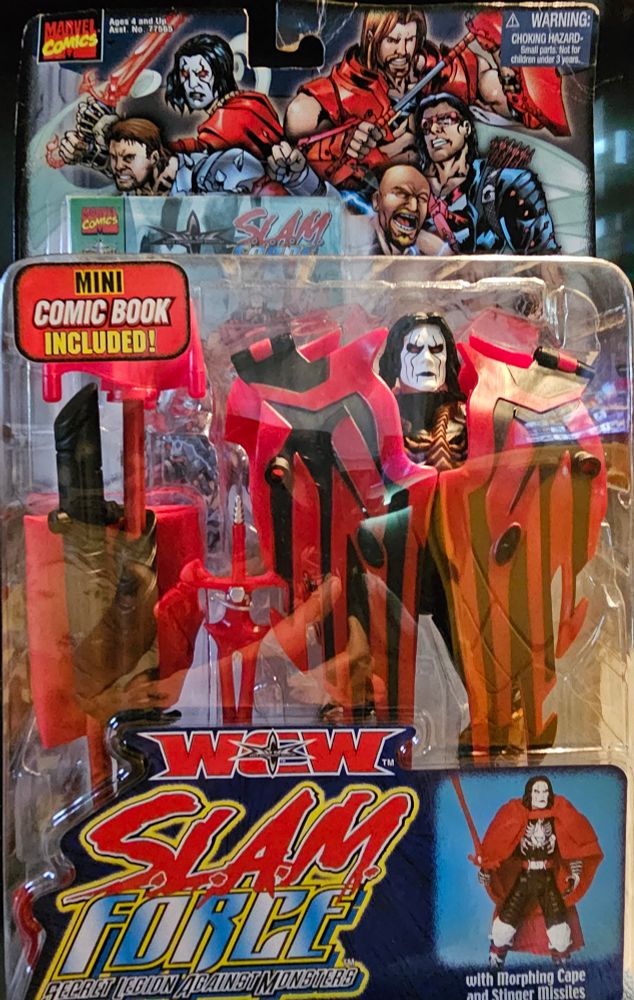 A Sting figure featuring additions to stings shoulders of large pauldron like wings and multiple weapons in the package. Also includes comic book behind the figure. Sting is pictured below with a figure stance. Very colorful wcw figure.