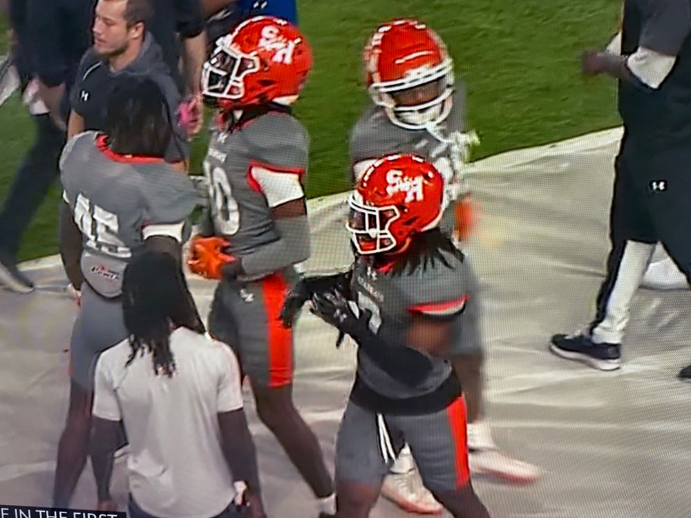 SHSU playing football in grey vs Delaware in white. 